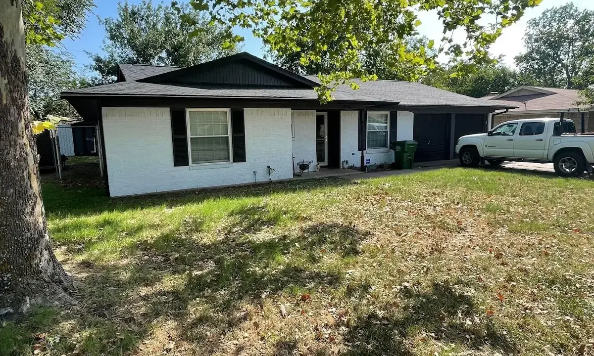 Professional roofing crew working on a residential roof in Albuquerque
